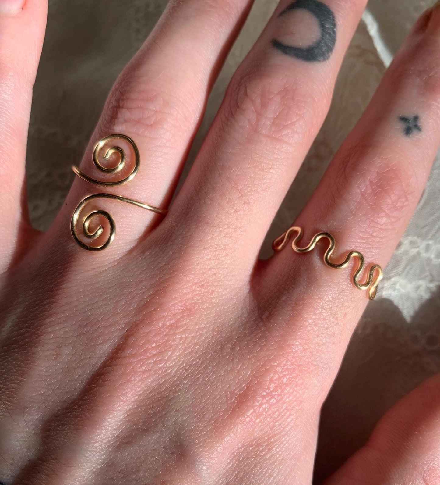 Gold squiggly and swirly set adjustable rings