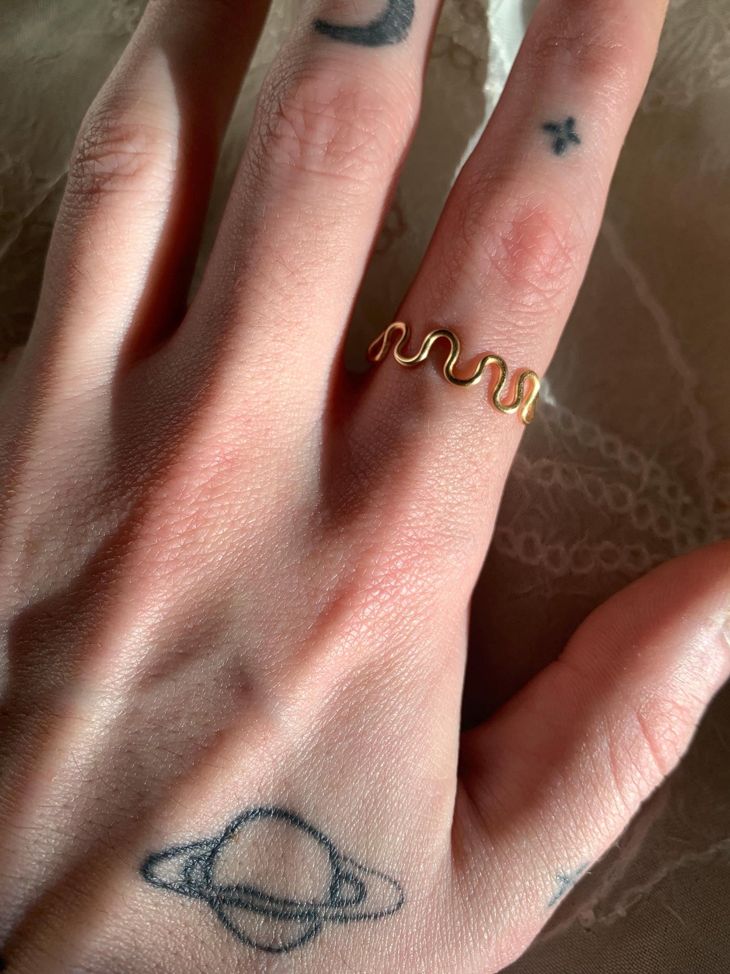 Gold squiggly and swirly adjustable rings