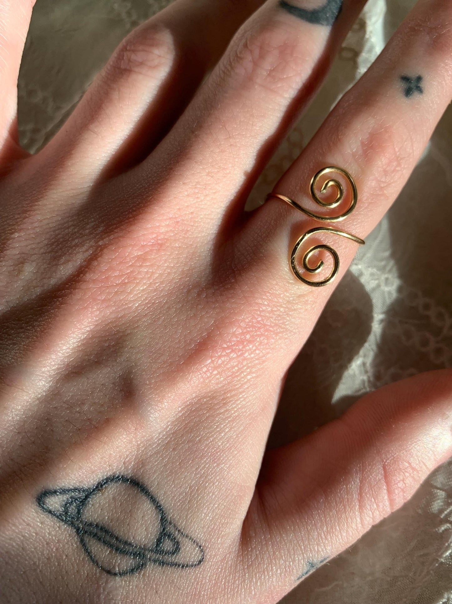 Gold squiggly and swirly adjustable rings