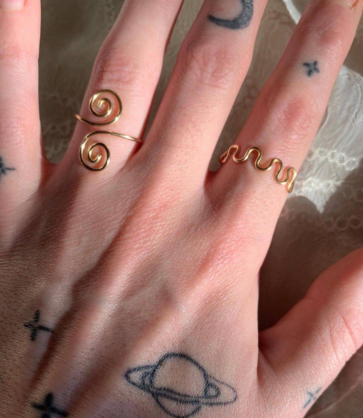 Gold squiggly and swirly adjustable rings