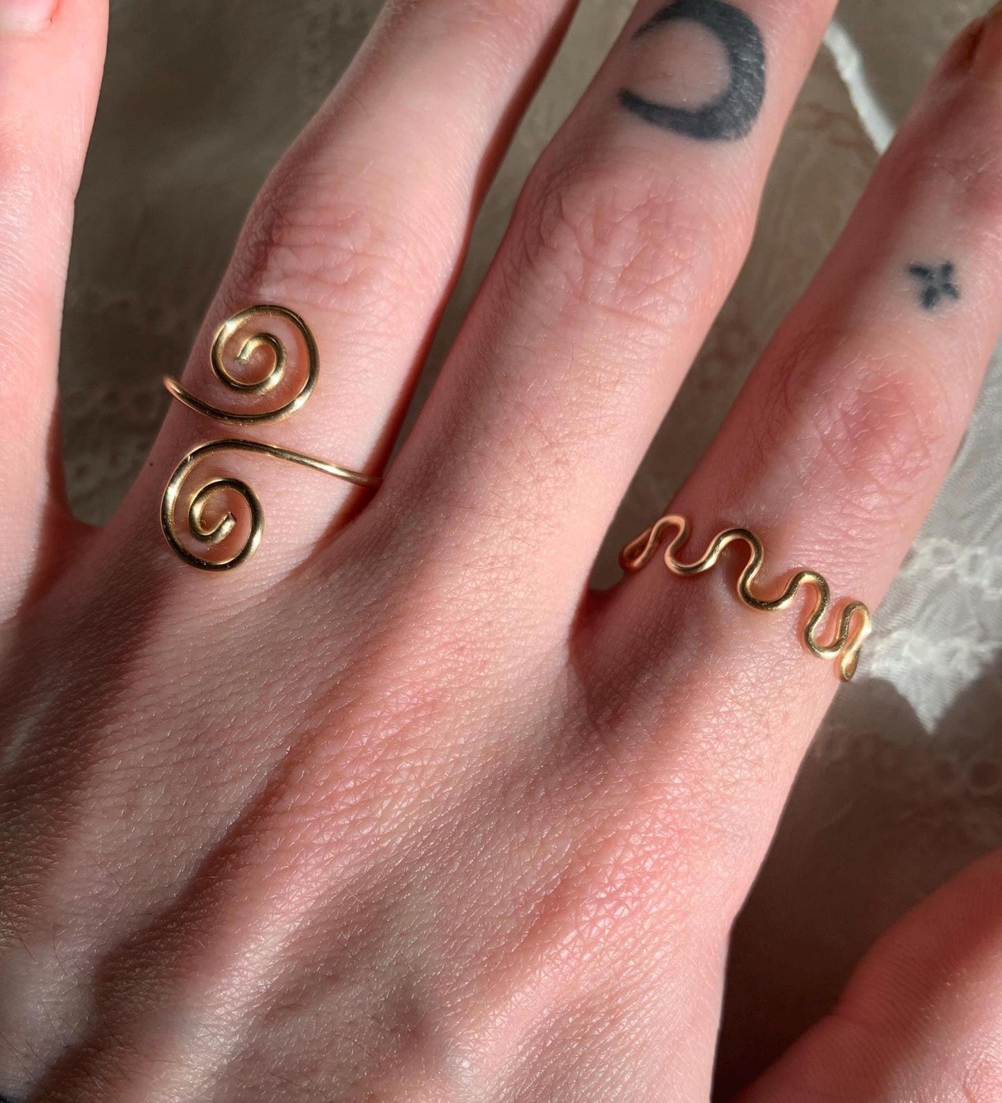 Gold squiggly and swirly adjustable rings